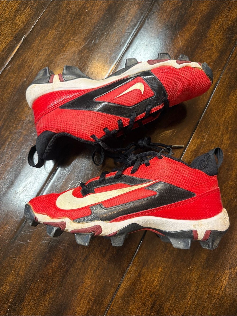 Nike Kids Red and Black Soccer Cleats with White Swoosh